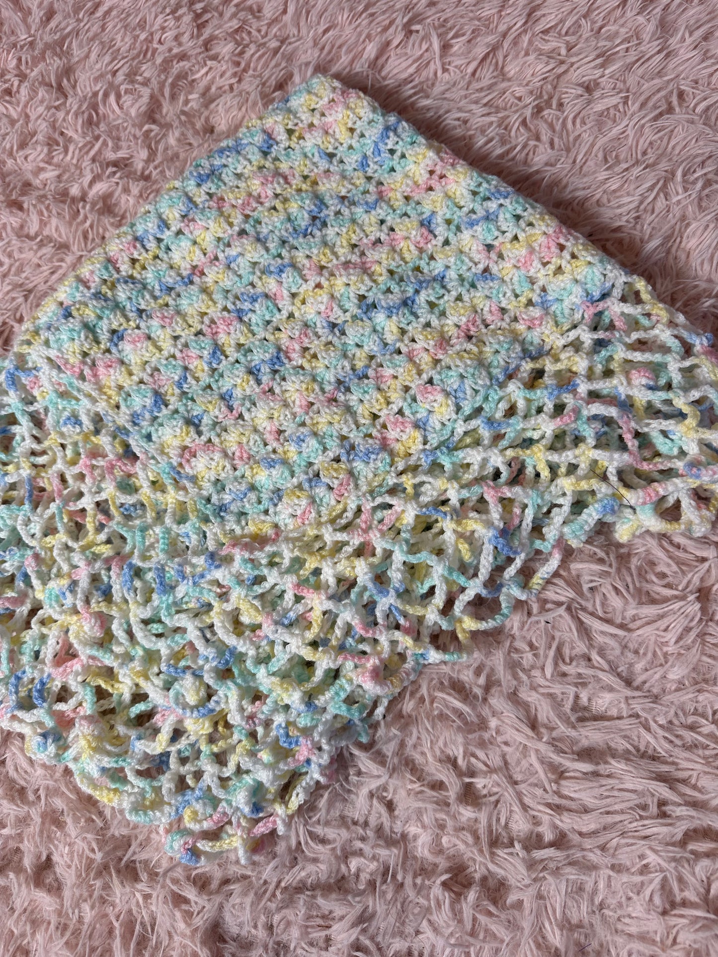 Handmade crocheted pastel blanket