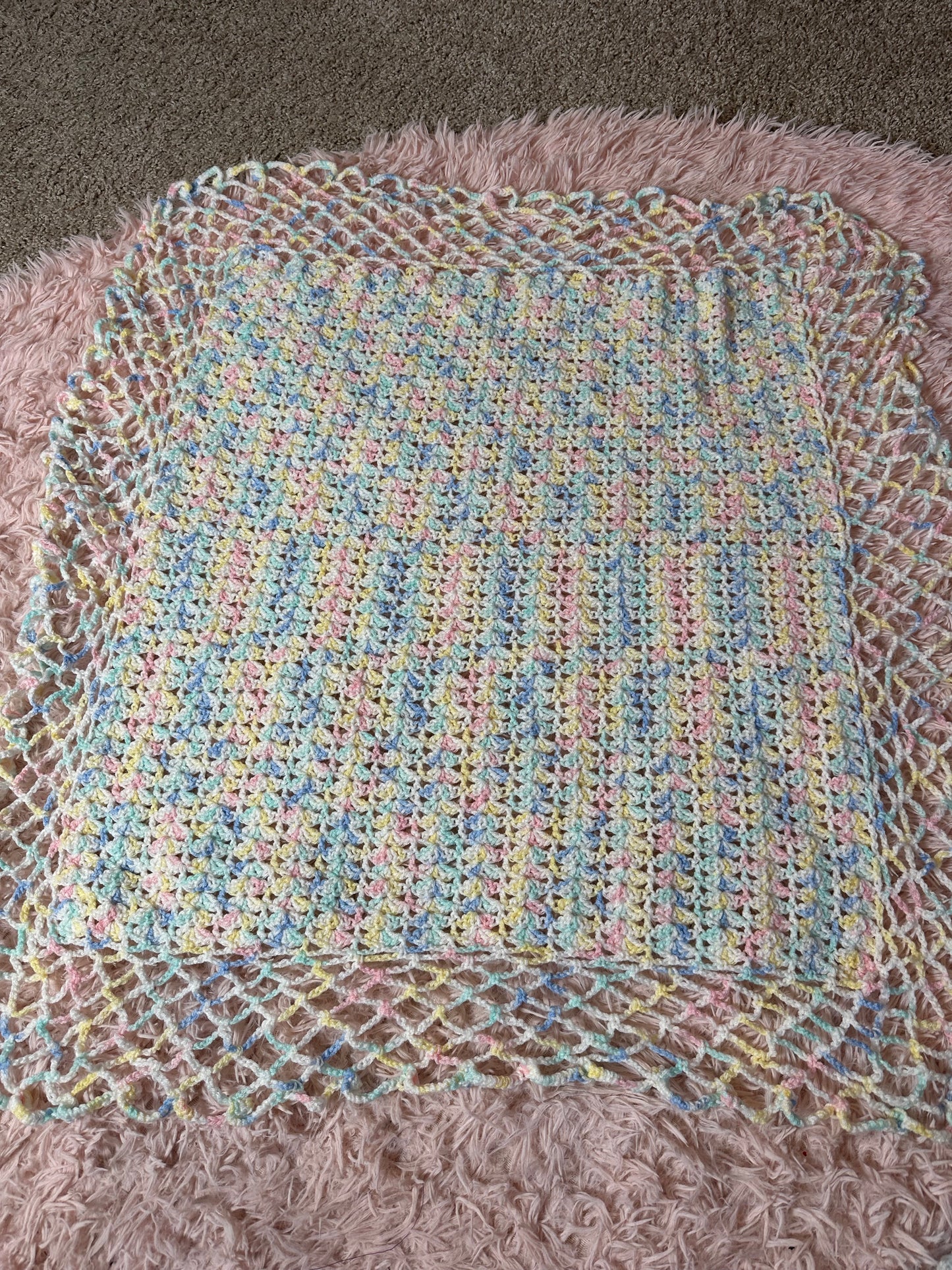 Handmade crocheted pastel blanket
