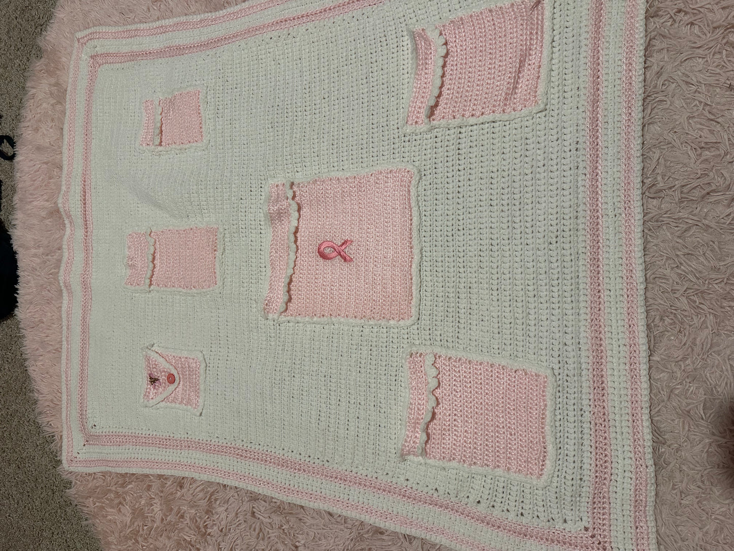 Handmade crocheted, white and pink breast cancer blanket with pockets