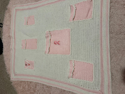 Handmade crocheted, white and pink breast cancer blanket with pockets