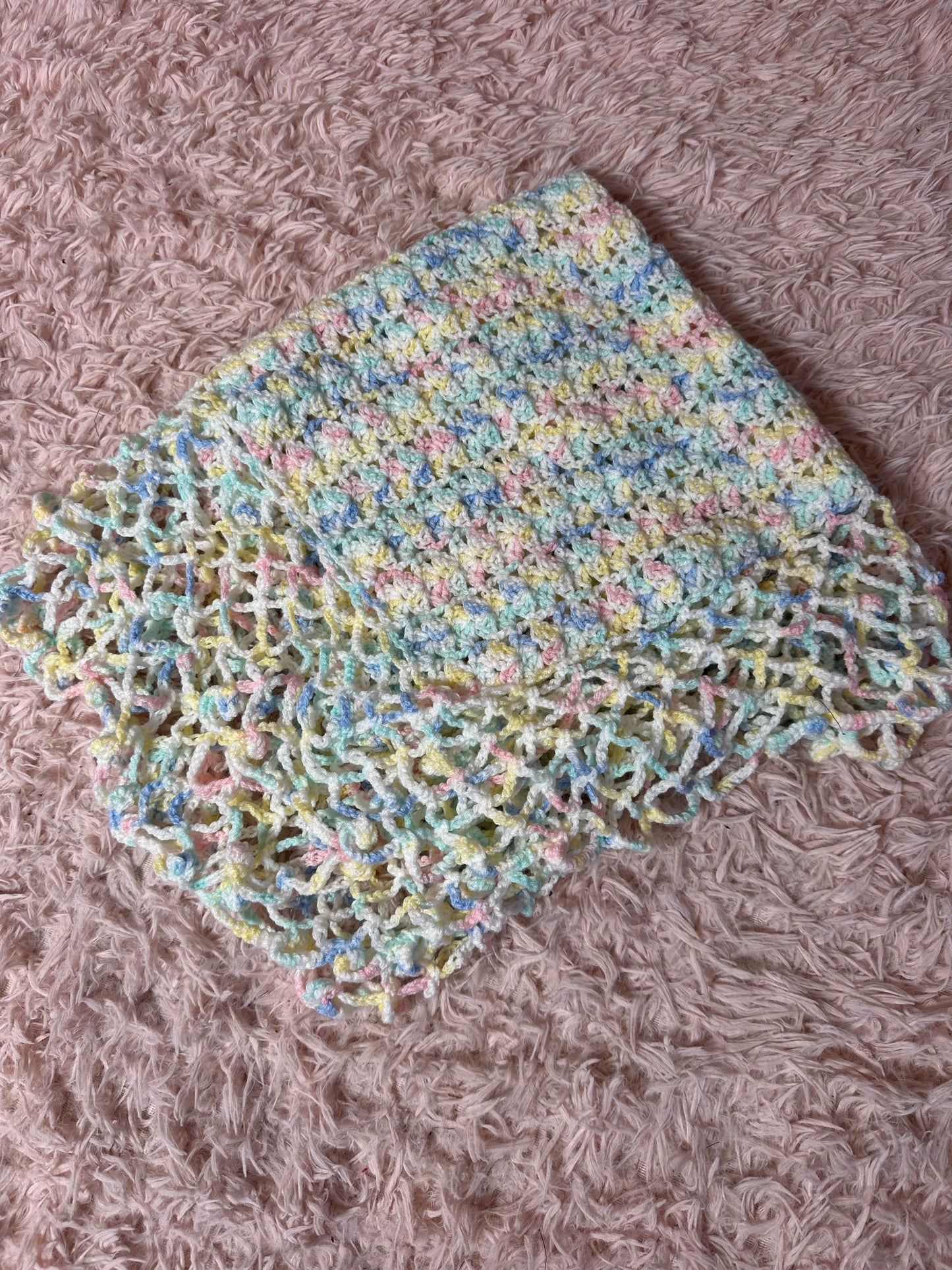 Handmade crocheted pastel blanket