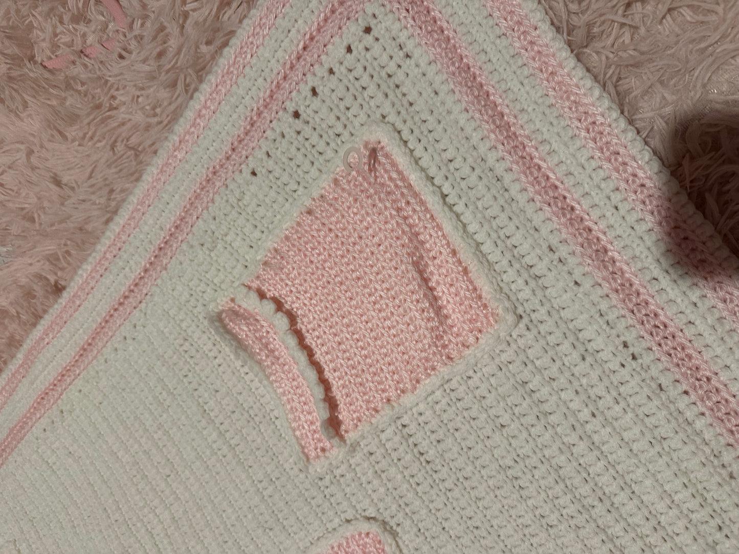 Handmade crocheted, white and pink breast cancer blanket with pockets