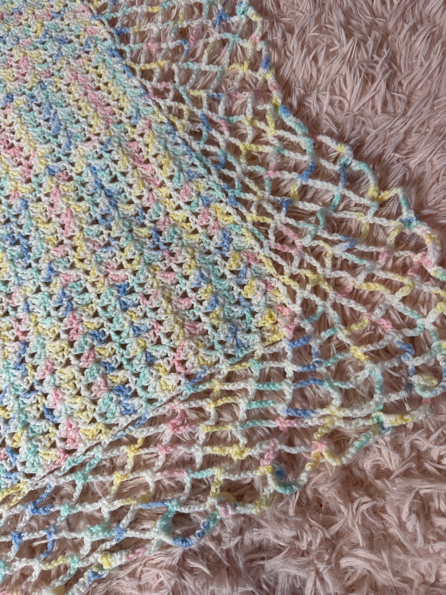 Handmade crocheted pastel blanket